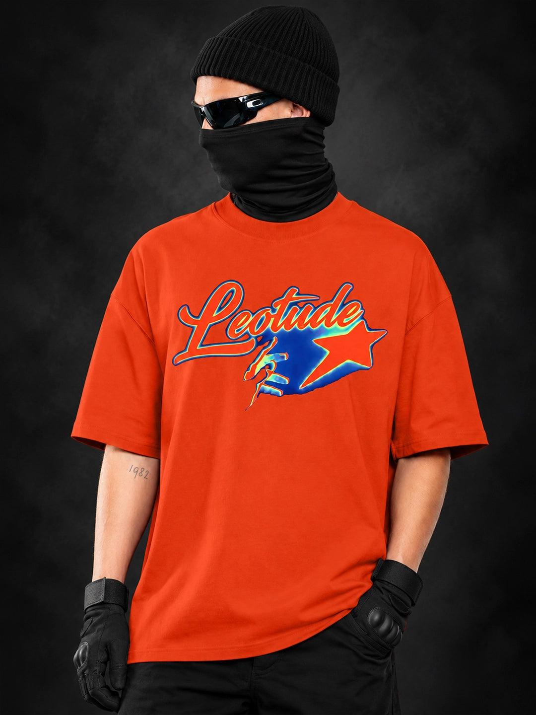 Leotude Men's Orange Signature Logo Elite oversized T-Shirt - front chrome script print